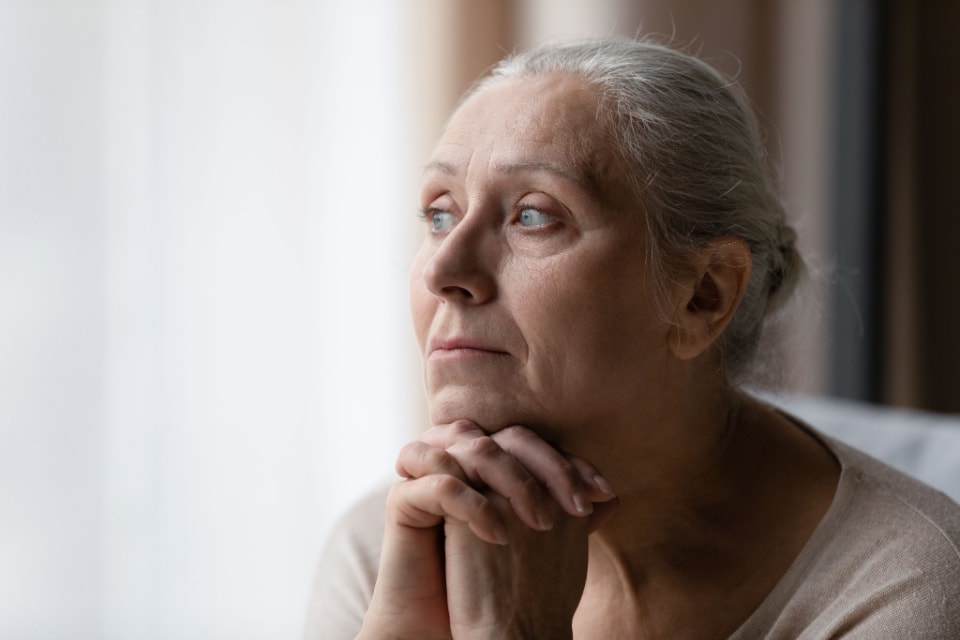 A senior woman deep in thought